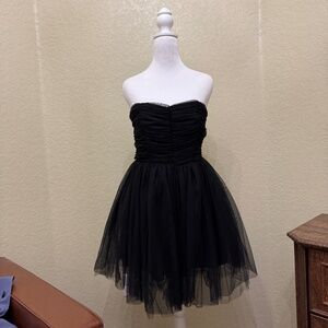 This listing is for a new, size S black prom or wedding dress from the brand "Fo